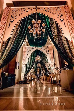Emerald and gold mandap entrance